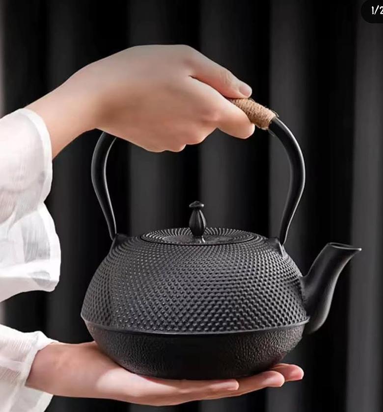 Heavy duty cast iron tea pot, with coaster and filter and spoon. image