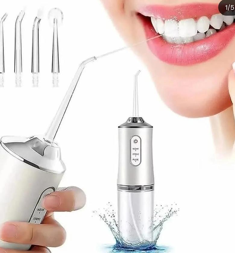 Rechargeable portable oral care irrigator with 4 nozzles image