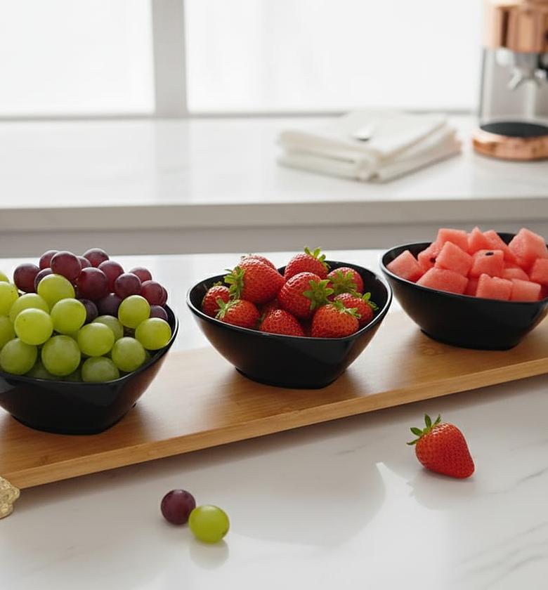 Heart-Shaped Black Ceramic Bowls on a bamboo tray image