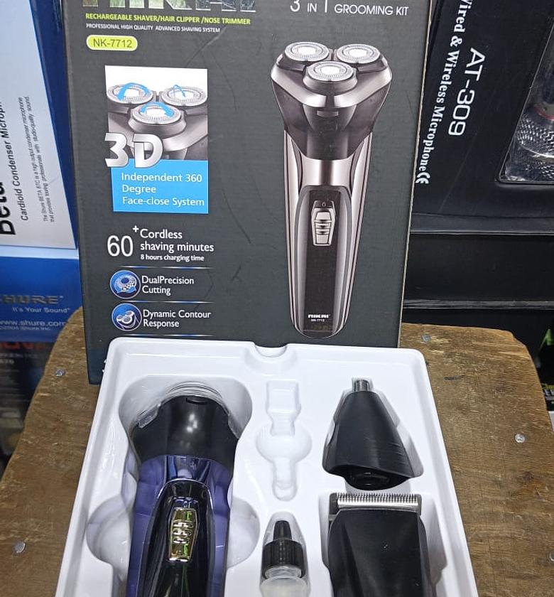 Nikai 3 in 1 Grooming Kit. Rechargeable shaver, hair clipper, and nose trimmer, offering a versatile grooming solution. image