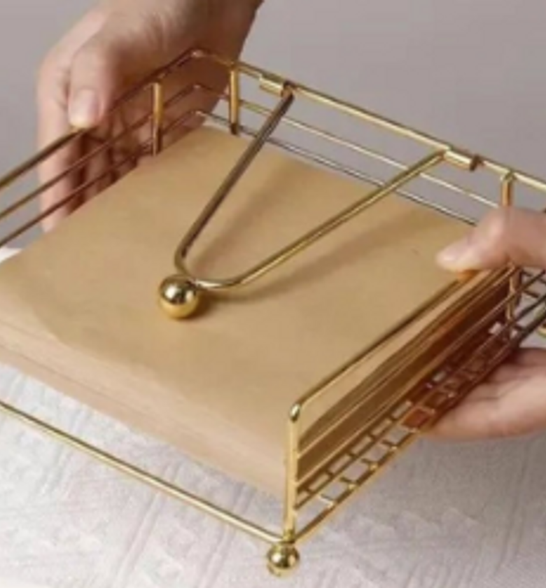 Metallic serviette holder. image