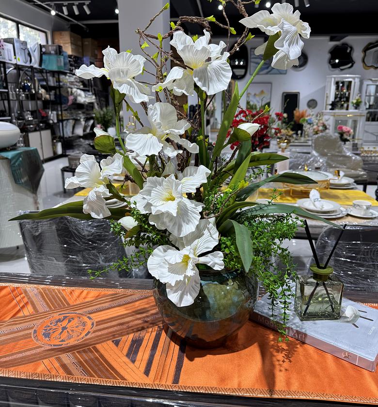 White iris in an earthy vase image