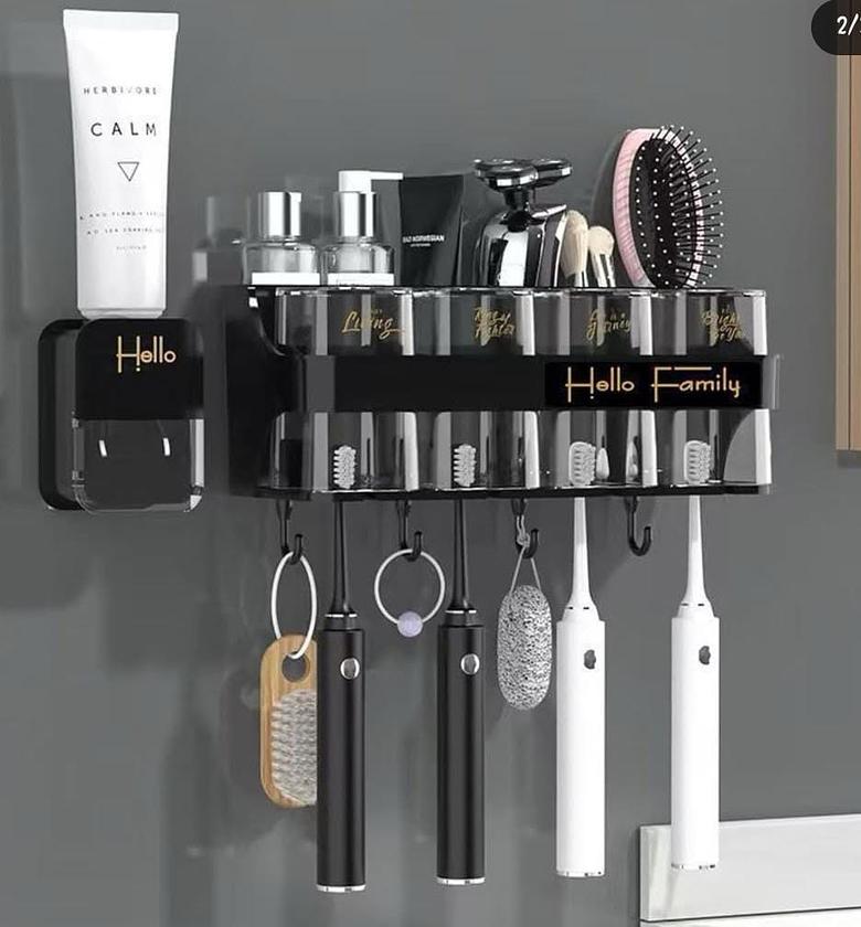 Toothbrush holder plus toothpaste dispenser. Comes with 4 cups. image