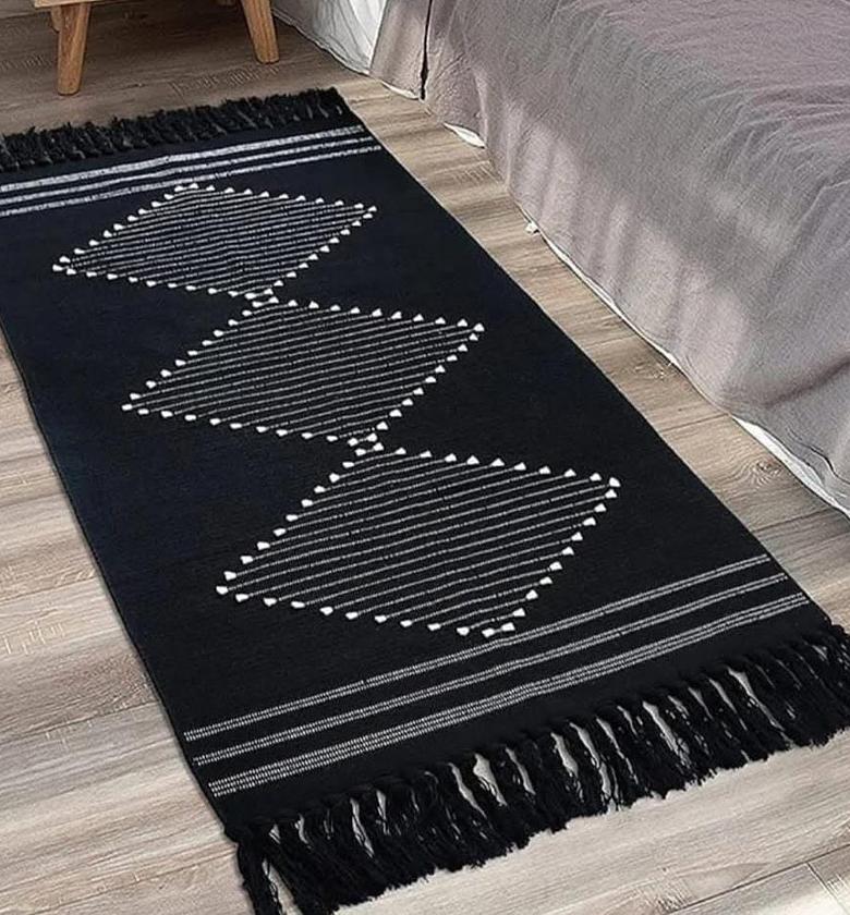 cotton woven area rug with tassels. image