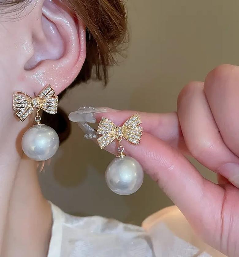 Crystal bow pearl earrings  image