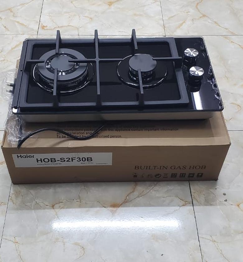 Haier glass inbuilt 2 burner with wok burner hob cook image