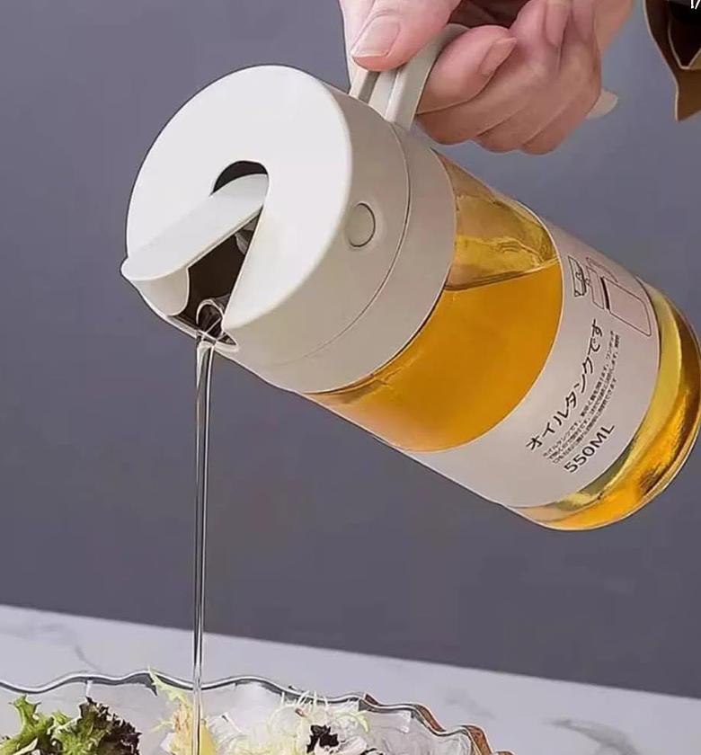 Automatic glass oil dispenser. image