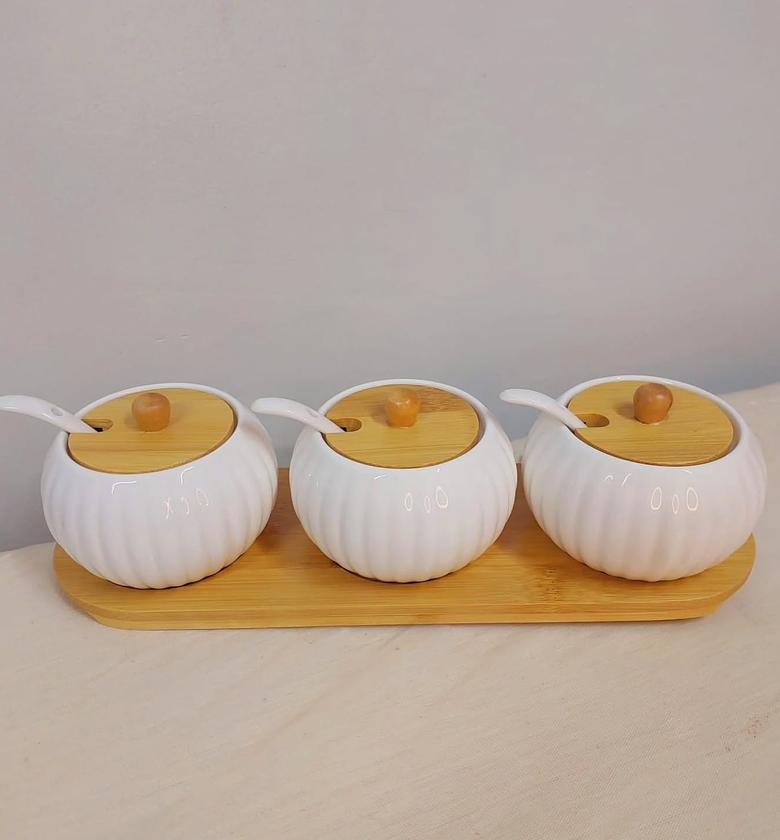 Seasoning canisters with bamboo tray. image