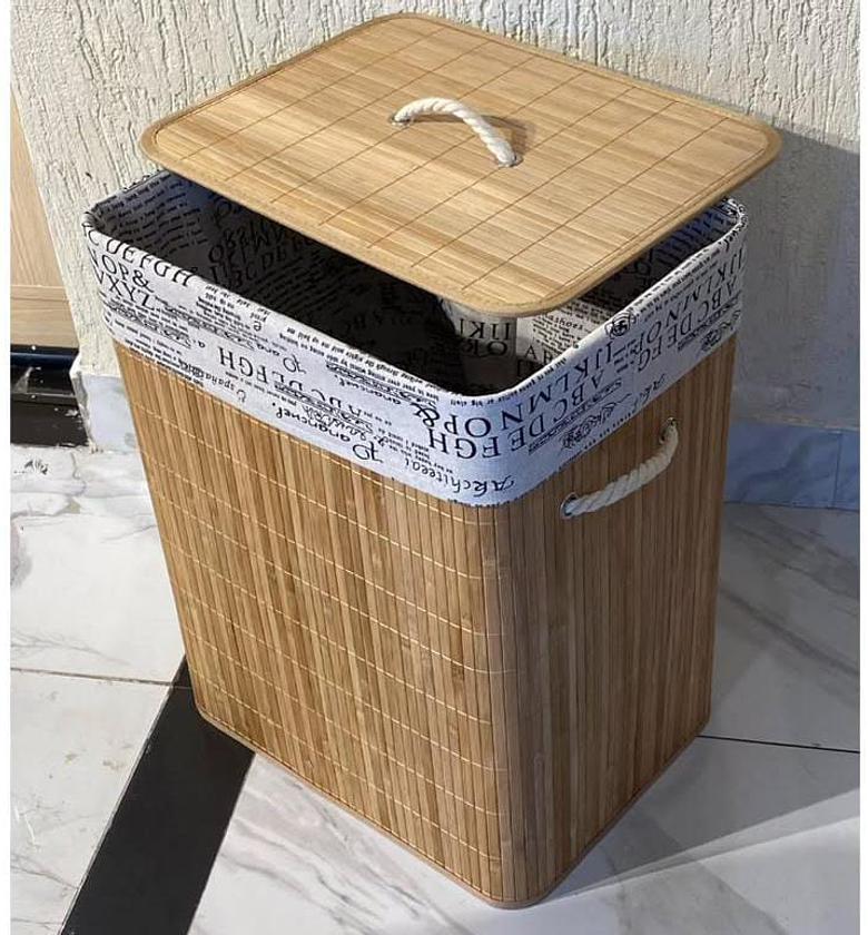 Bamboo laundry basket with linen lining. image