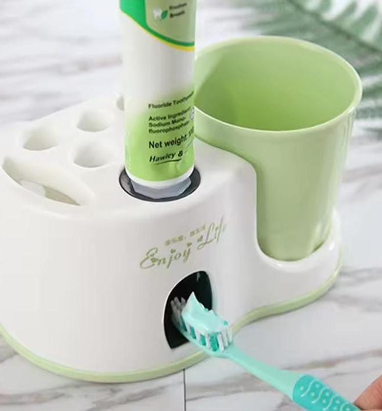 Toothbrush Holder and Toothpaste Dispenser With a Cup image