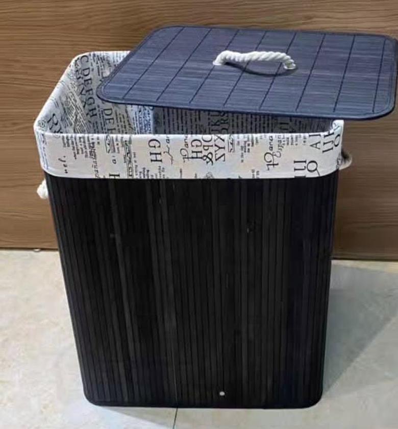 Bamboo laundry basket with linen lining. image