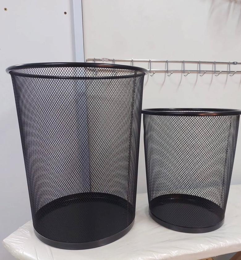 Metallic mesh trash cans. image