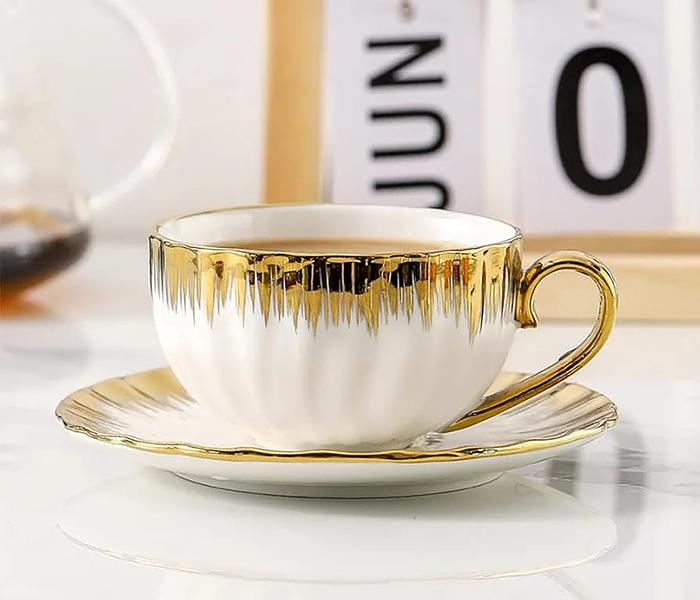 Cup and Saucer Shells-white and  gold image