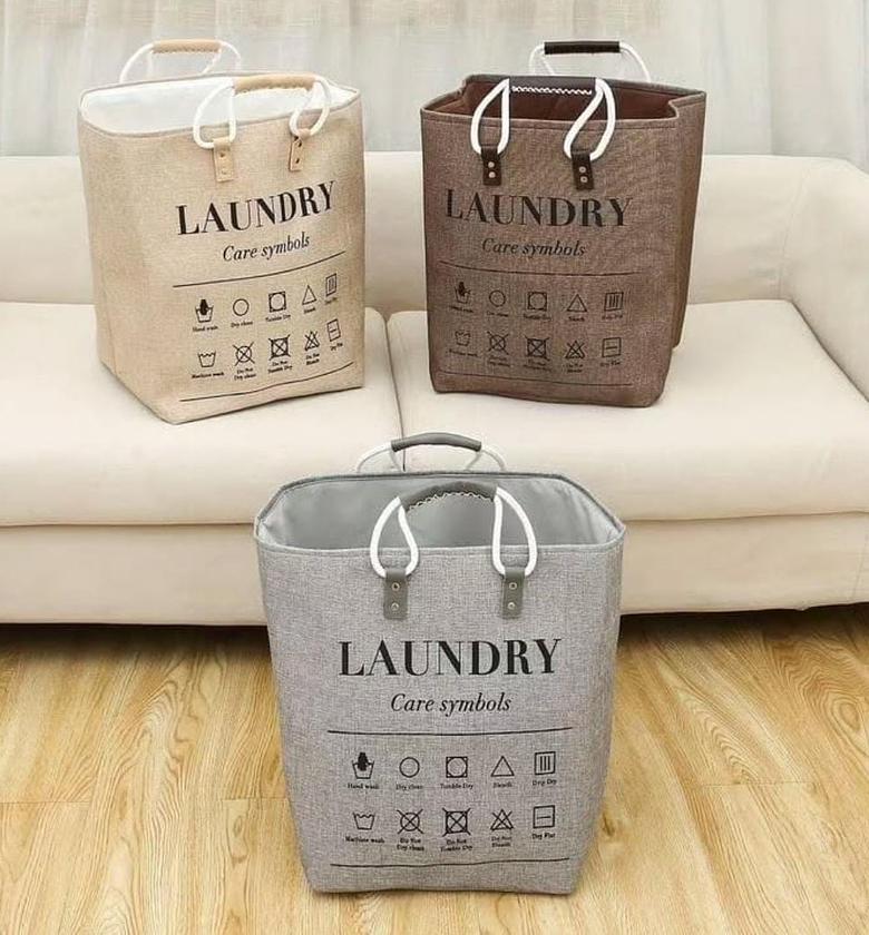 Large foldable laundry basket with rope handles. image