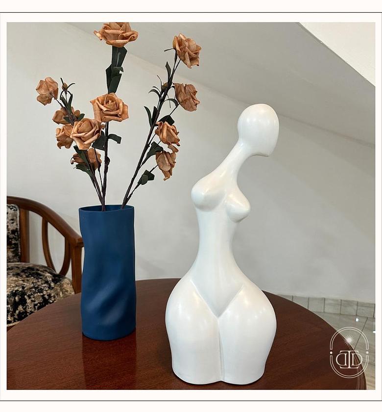Ceramic abstract body sculpture in white. image