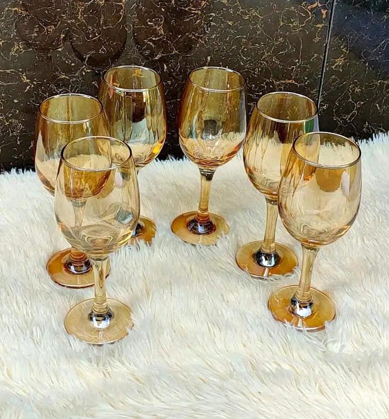 Golden wine glasses   image