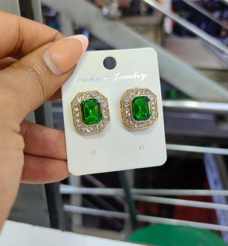 Green stones and crystals on gold image