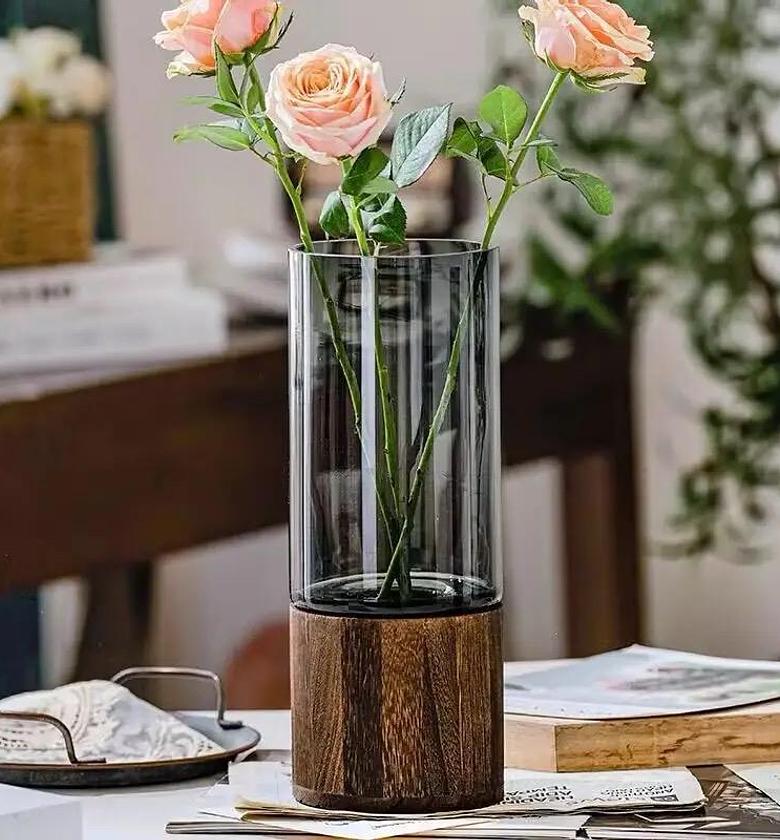 Modern creative glass vase with wooden base image