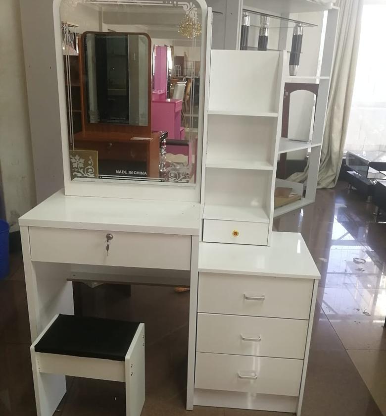 DRESSING TABLE. Dressing table with sliding mirror image