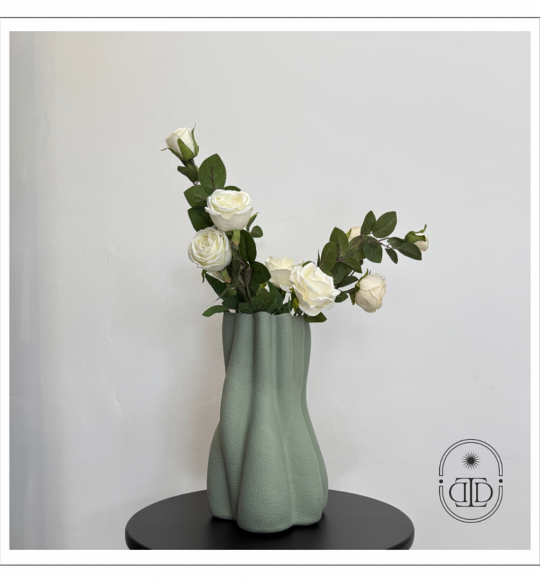 Sage green textured flower vase. image