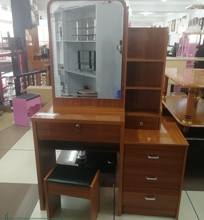 Brown dressing table with sliding mirror image
