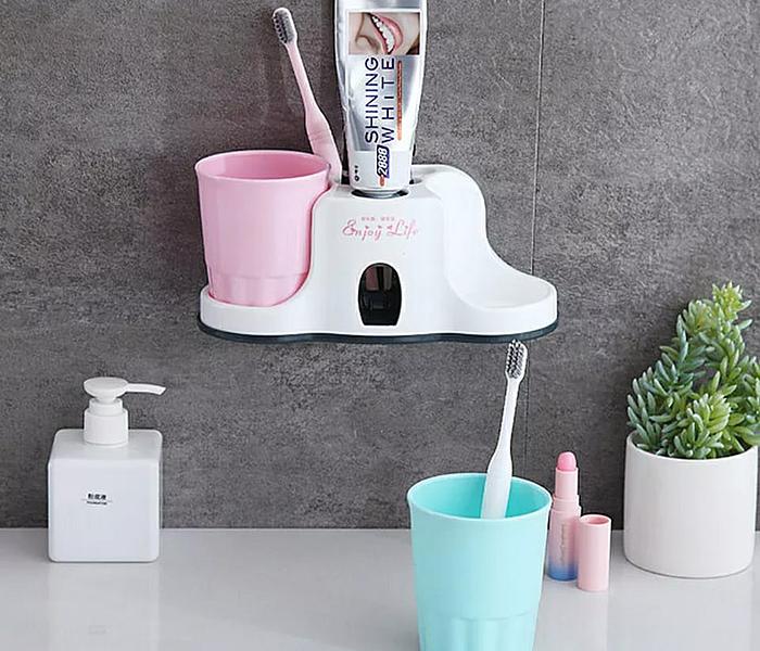 Toothbrush holder with toothpaste dispenser image