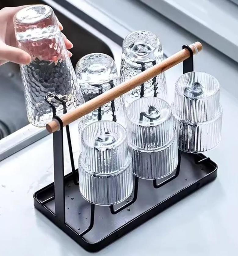 Metallic glass/cup holder with wooden handle. image