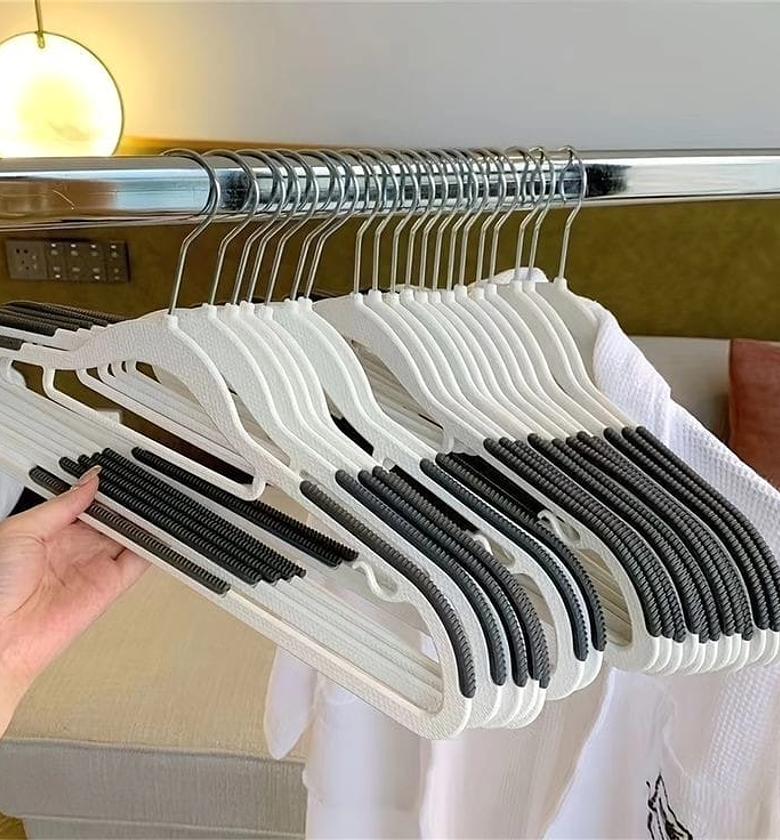 10pcs seemless Hangers  Material:ABS  Velvet surface and notched shoulders to prevent slipping. image