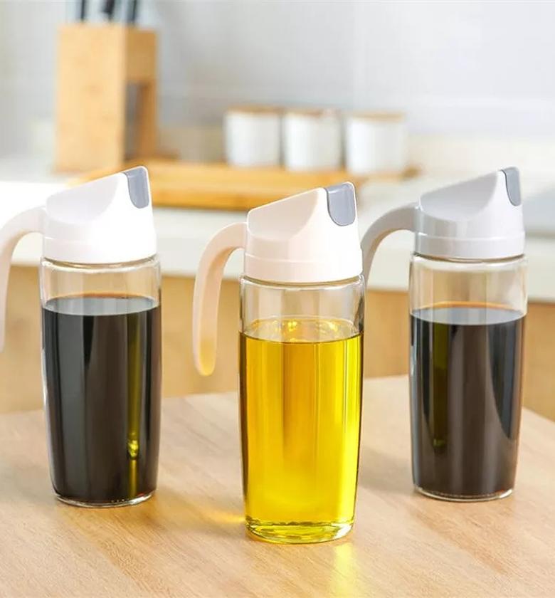 Olive oil dispenser bottle,600ml leakproof condiment container with automatic cap and stopper,non-drip spout,non-slip handle for kitchen cooking white image