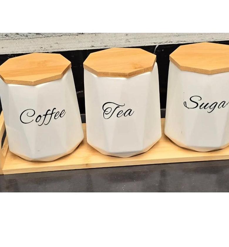 3pcs ceramic canisters with wooden base. image