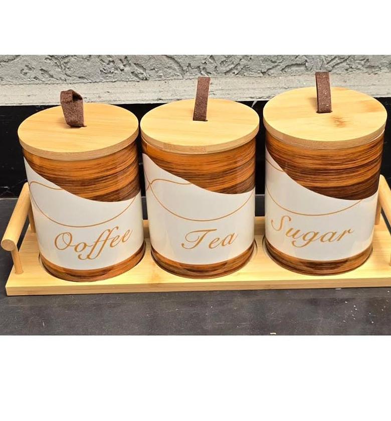 3pcs ceramic canisters with wooden base. image