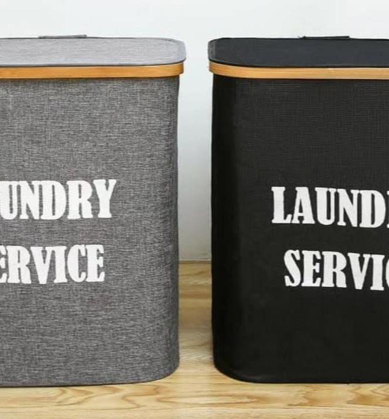 Laundry basket with top cover and bamboo frame at the top. image