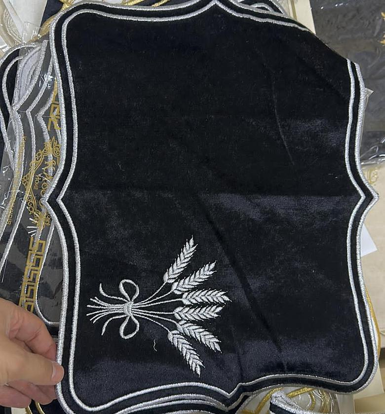 Black and silver embloided linen placement image