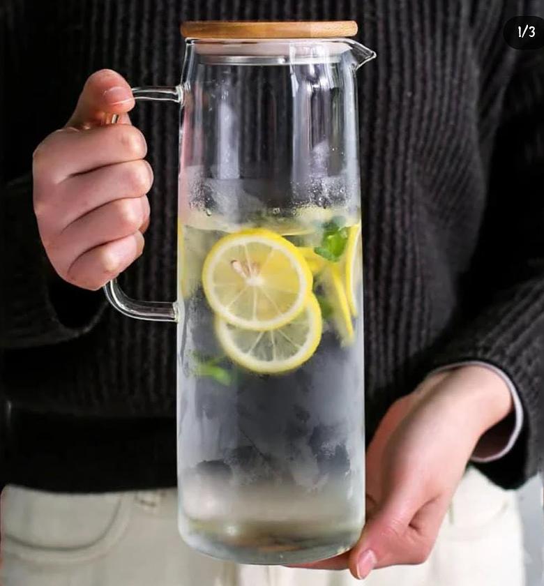 Glass water/juice jug with bamboo lid. image