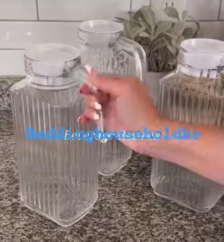 Glass water/juice jug. image