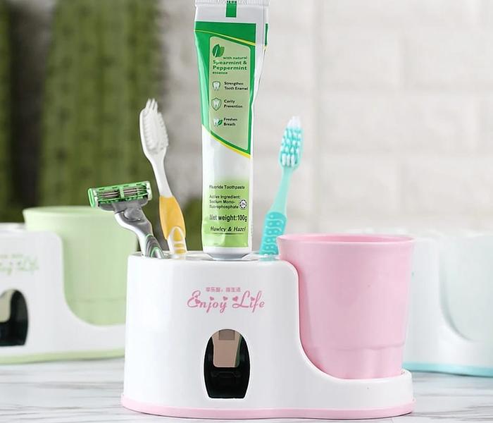 Toothbrush holder with toothpaste dispenser image