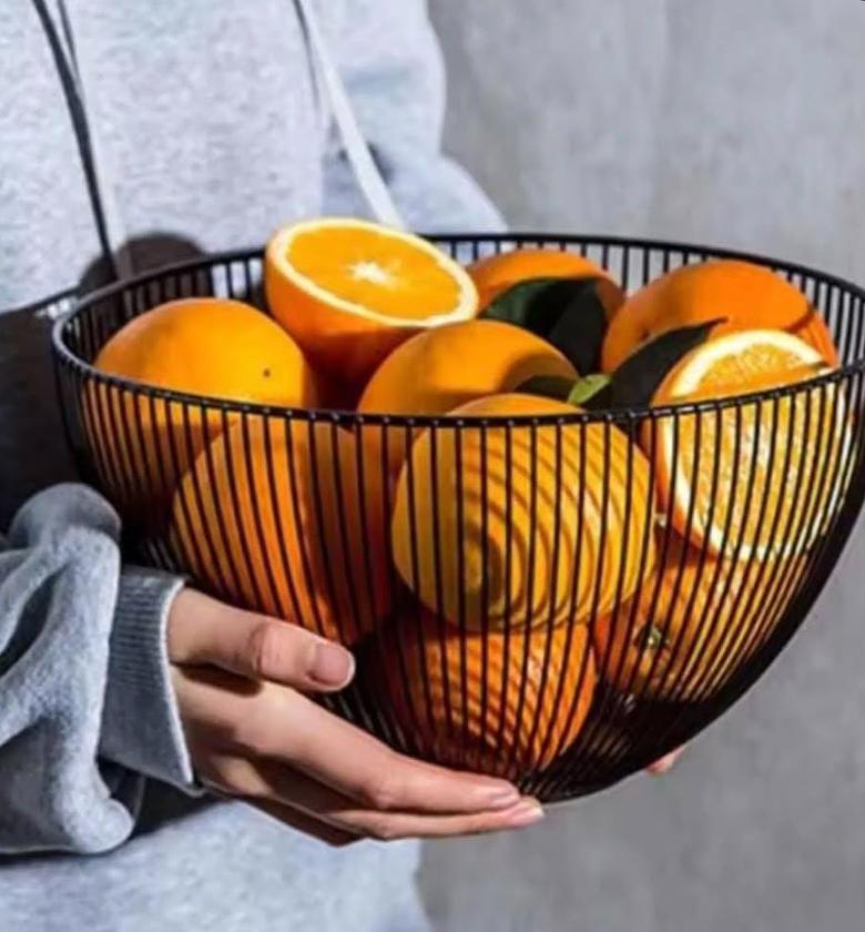 Large metallic fruit basket. image