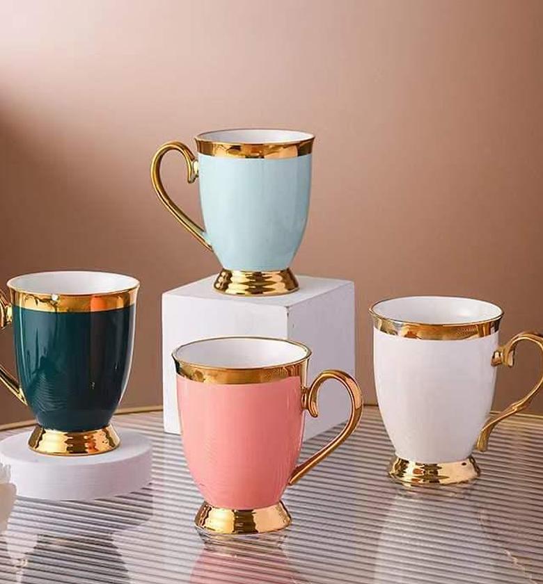  6 shapely gold ring coloured cups image