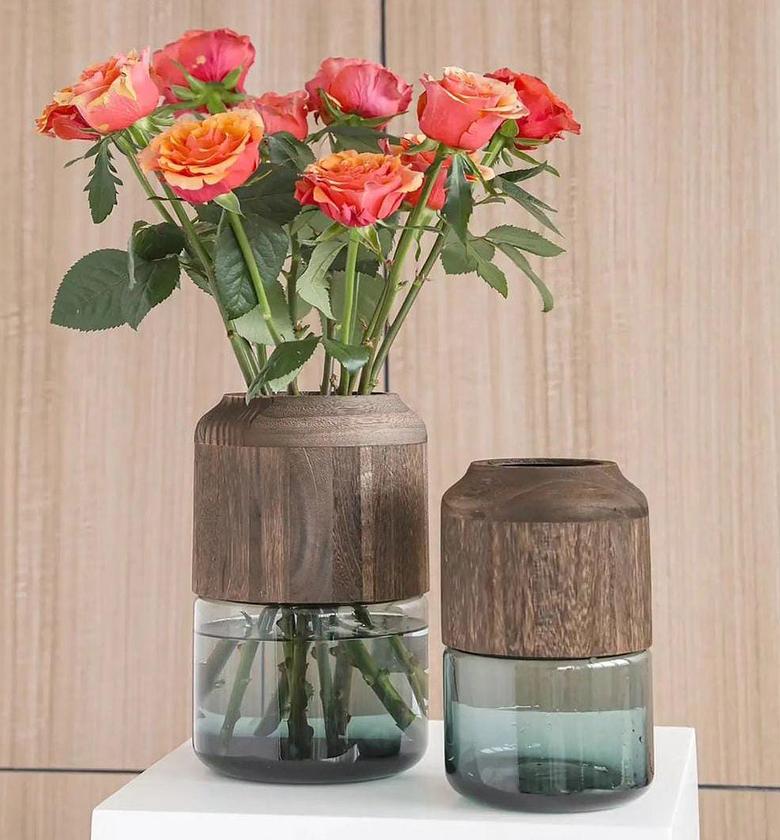 Modern creative glass vase with removable wooden decorative touch. image