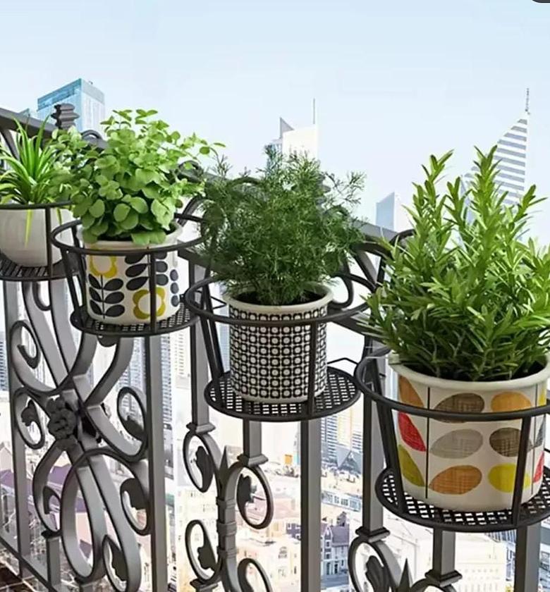 The Metallic Over-the-Balcony Flower Pot Holder adds a touch of vertical greenery and stylish charm to your outdoor space. image