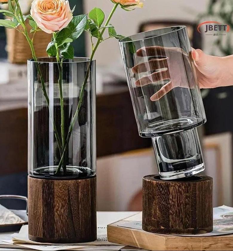 Modern creative glass vase with wooden base image