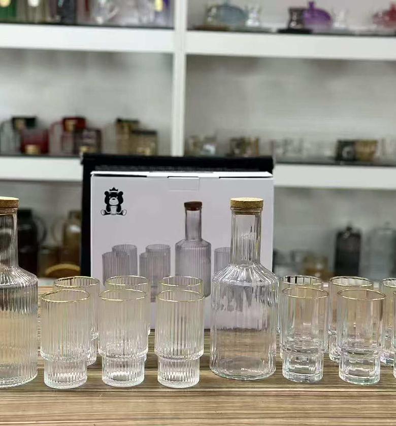 Elegant 7-Piece Custom Vertical Decanter and Gold-Rimmed Highball Glassware Set image