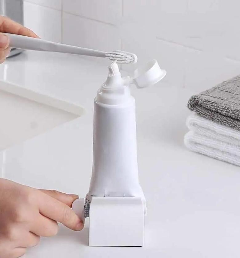 CLEANSER SQUEEZER.  Roll up toothpaste facial cleanser squeezer image