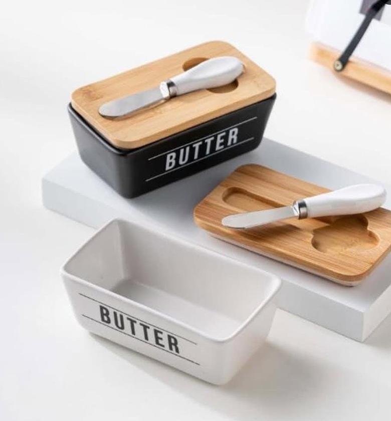 New ceramic butter box with wooden lid and butter knife. image