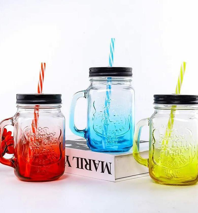 Mason jar with lid and straw  image