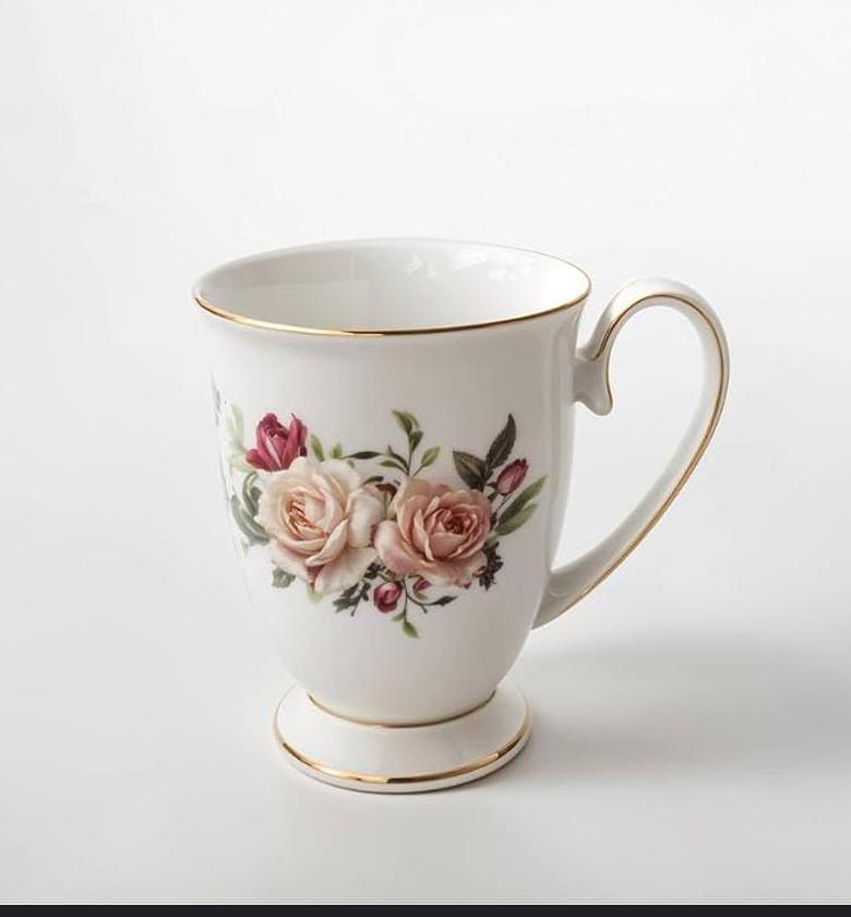 Bone china carnation cup shapely ,  Material fine bone  Capacity 325ml Comes with different flowers image