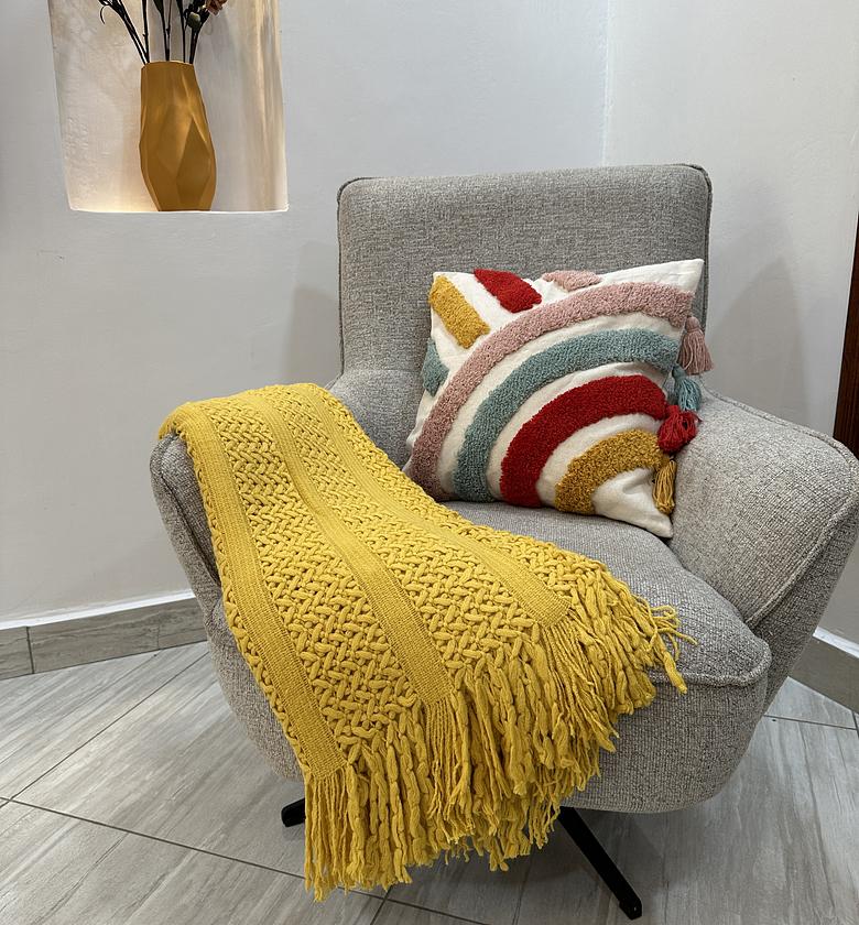 Light mustard throw blanket with tassels. image