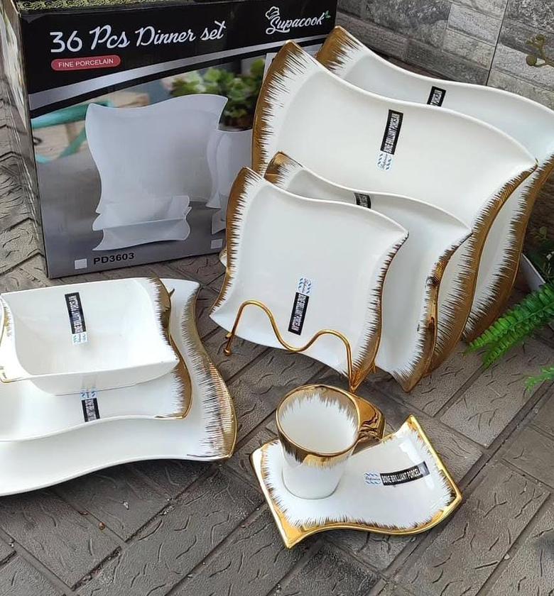 36pcs Nordic shapedly dinner set with gold rim. image