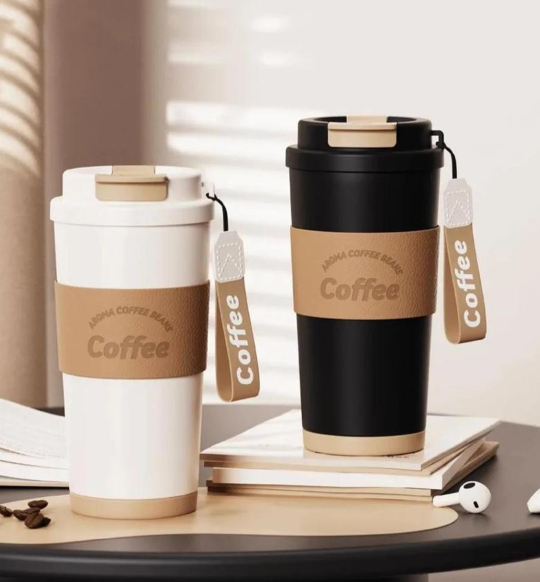 vacuum insulated stainless steel Coffee mug with a leather sleeve and a straw image