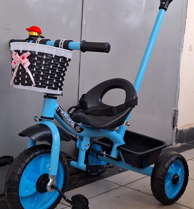 Kids Tricycle. Tricycle with a Push Handle and Storage Basket.  image